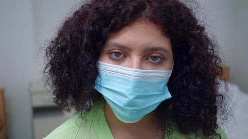Woman in Surgical Mask Close Up