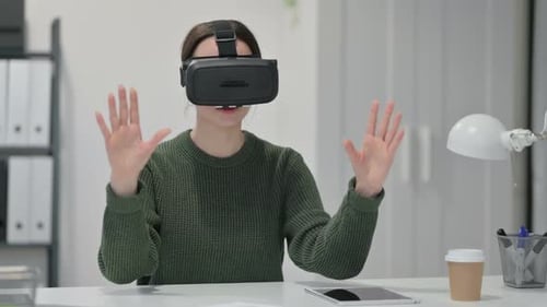 Woman Experiencing Virtual Reality Technology in Modern Office