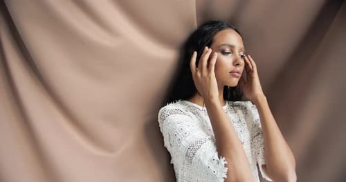 Elegant Woman Posing in Studio Fashion Shoot