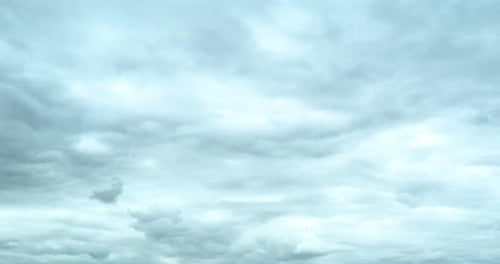 Dramatic Gray Clouds Moving Across a Bright Sky