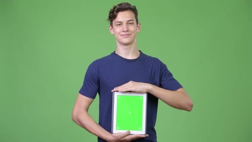 Young Adult Holding Digital Tablet with Green Screen