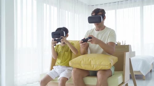 Father and Son Playing VR Games at Home