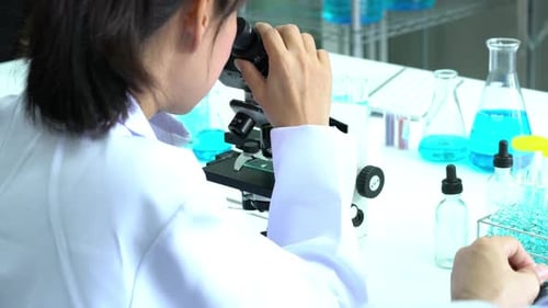 Scientist with microscope