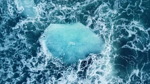 Iceberg Huge Chunks of Blue Ice Floating on the Waves in the Ocean Beautiful Arctic Landscape Aerial