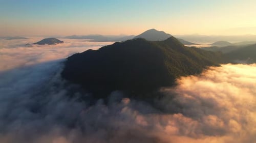 A sea of clouds above the valley and the mountains in the background