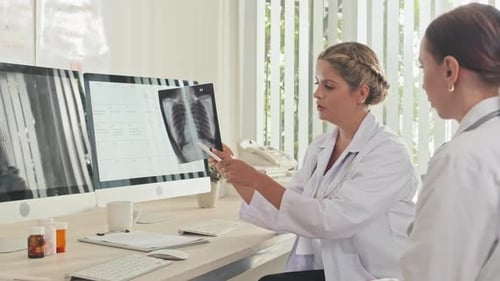 Doctors Analyzing an X-Ray in Bright Office