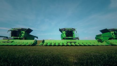 Grüne große Erntemaschinen