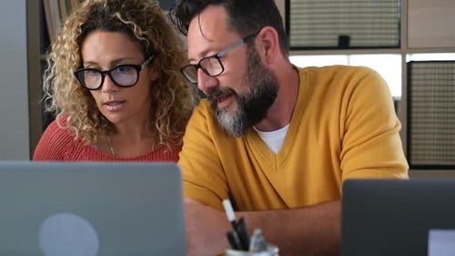 Happy adult couple work at home together with video conference call from room office