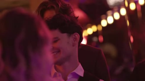 Friends Dancing at a Party in Nightclub