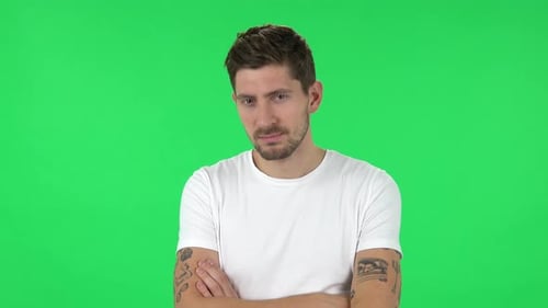 Portrait of Confident Guy Is Looking Straight and Crossing His Arms Over His Chest