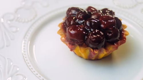Delicious Cherry Cupcake on a Plate