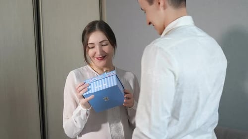 Loving Couple Celebrating with a Birthday Gift