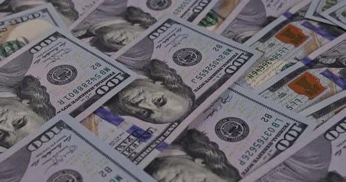 Pile of One Hundred Dollar Bills Panning Shot