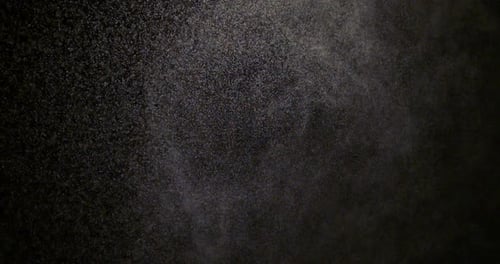 Abstract Motion of Floating Particles on Black Background