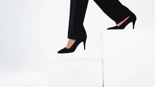 Business Woman Steps Upward on White Stairs