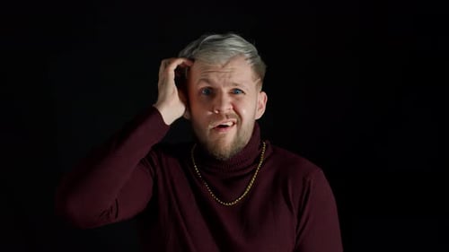 Man with Silver Hair Puzzled and Shrugging