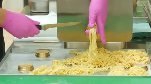 The Cook Makes Noodles