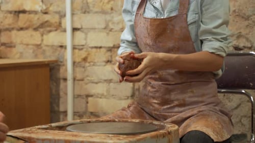 Female Potter Hands Working with Clay in Workshop