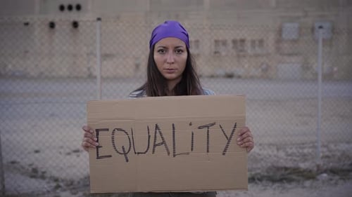 Feminist Woman Holding a Placard Saying Equality