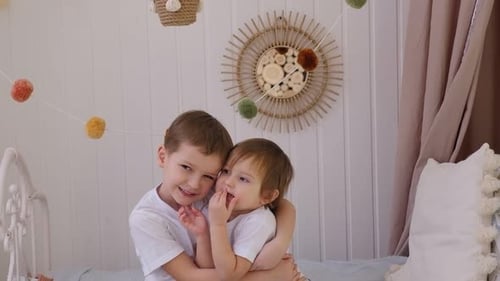Affectionate Children Embrace in Bright Room