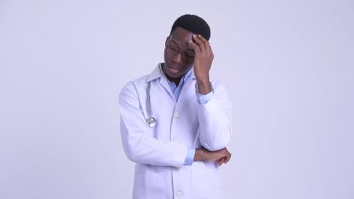 Concerned Young Doctor Thinking Hard About Difficult Problem