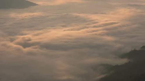 Aerial View of Golden Clouds Over Mountains