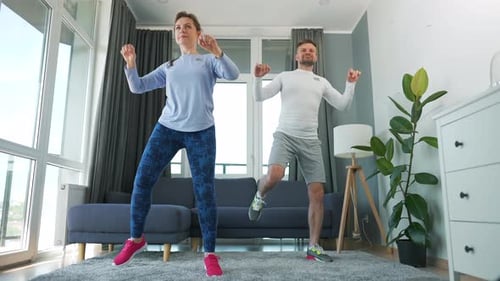 Couple Working Out Together Indoors at Home