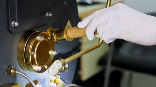 Operating Lever to Release Roasted Coffee Beans