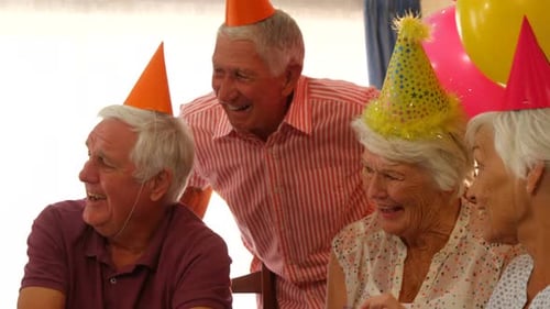 Seniors Laughing at Birthday Party Celebration