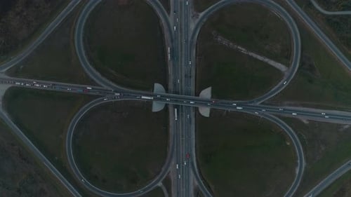 Aerial View of Highway and Overpass in City.