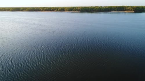 Flying Over the Beautiful Spring River. Aerial Camera Shot. Ukraine