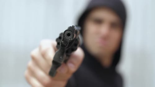 Close Up of Handgun Pointing at the Camera