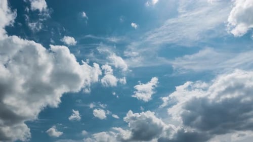 Time-Lapse of Dramatic Clouds Across Blue Sky