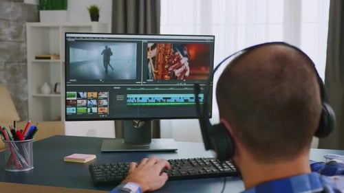 Adult Edits Video at Home Computer