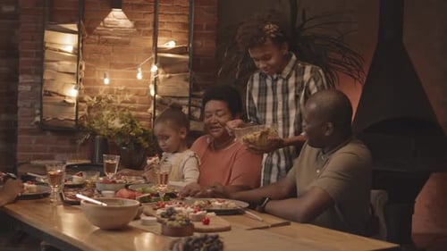Family Meal Around a Dinner Table Indoors