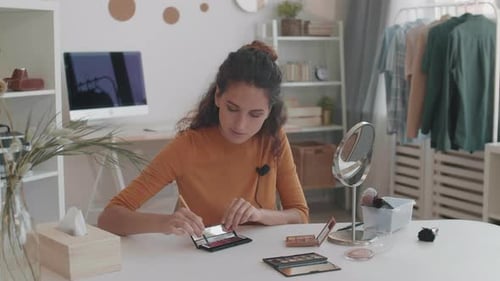 Woman Demonstrates Makeup Techniques at Home