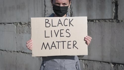 Person Holding Black Lives Matter Sign