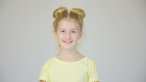 Happy Child Smiles in Studio Close Up