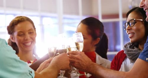 Colleagues Toasting Champagne at Work Celebration