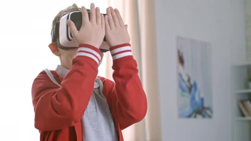 Boy Exploring Virtual Reality in Bright Room
