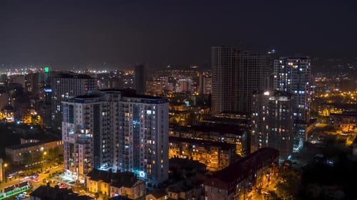 Multistorey Buildings with Changing Window Lighting At Night in City. Timelapse