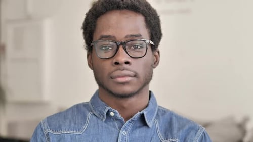 Young Adult Close Up Portrait Looking at Camera