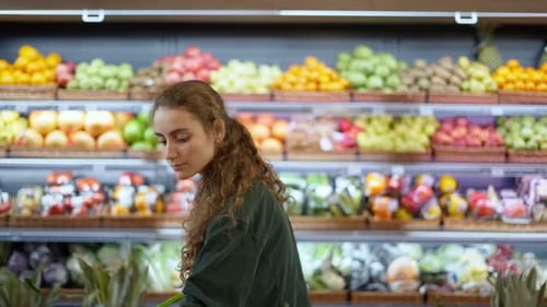 Young Woman Shopping for Fresh Fruit at Grocery