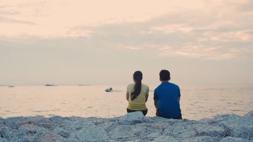 Couple Watching the Ocean at Sunset