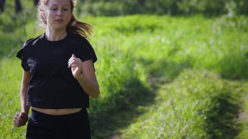 A girl running in the forest