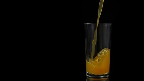Pouring Orange Juice into a Glass