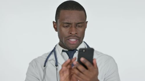 Doctor Using Mobile Phone Close Up in Studio