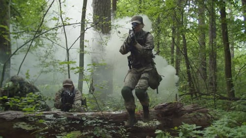 Soldiers in Forest Advance Through White Smoke