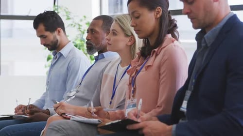 Business people attending to a meeting in conference room