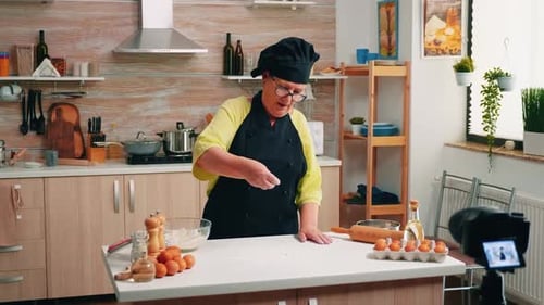 Woman Chef Prepares Dough in Bright Kitchen